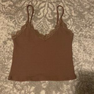 This is a brown tank top from garage in size Medium